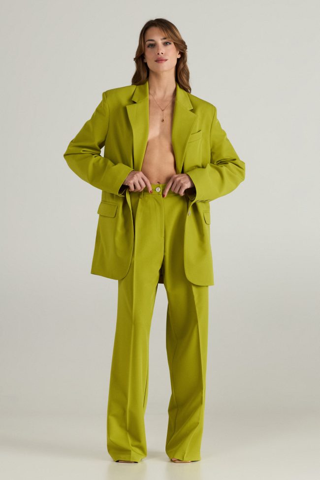 Model wearing light green cortsese set with blazer and high-waisted wide-leg pants.