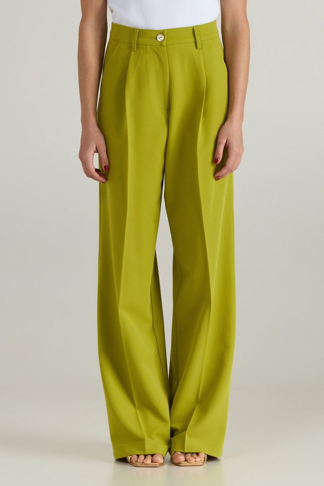 Model wearing light green cortsese set with blazer and high-waisted wide-leg pants.