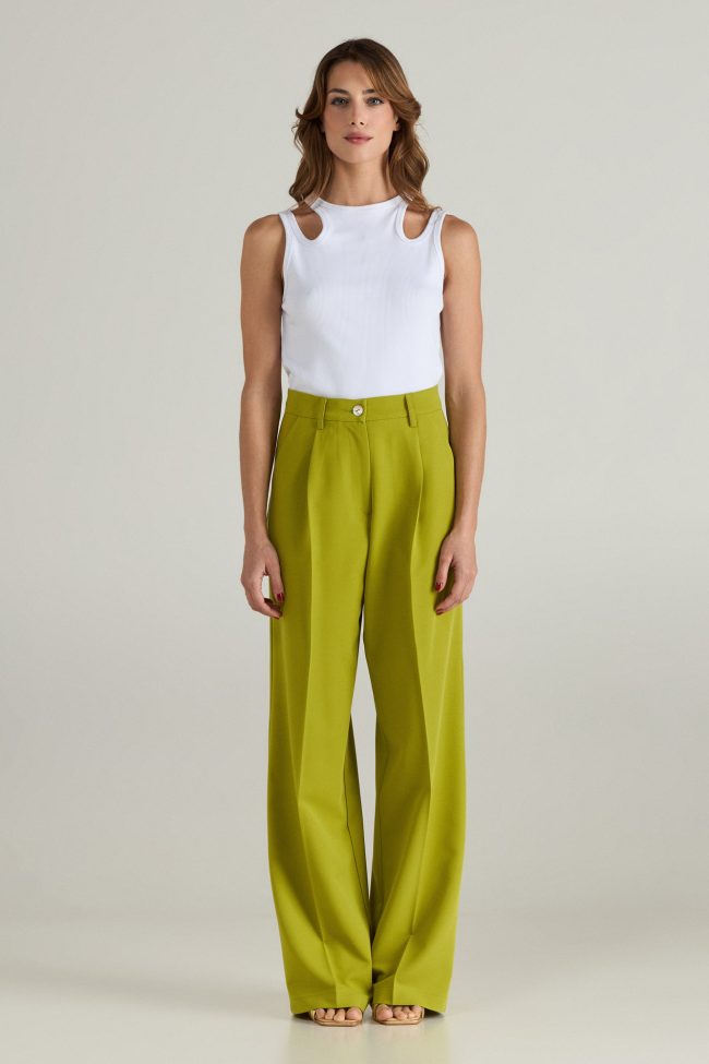 Model wearing light green cortsese set with blazer and high-waisted wide-leg pants.