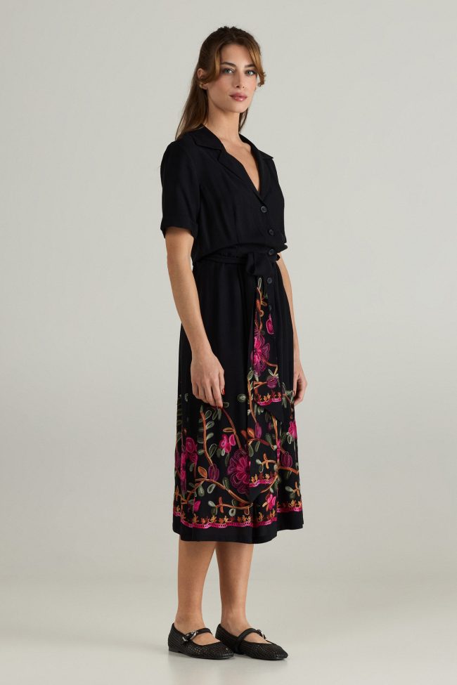 Noir Bloom Midi Dress by Flicka Athens – A black dress with buttons, a waist belt, and colorful embroidery for chic summer outfits