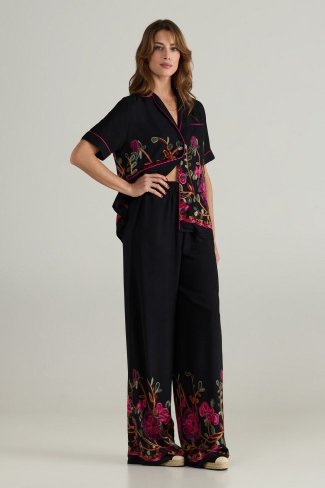 Black wide-leg trousers with floral embroidery and elastic waistband