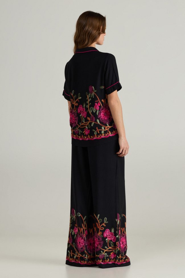 Black wide-leg trousers with floral embroidery and elastic waistband