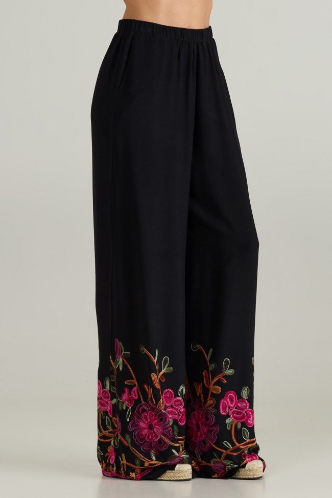 Black wide-leg trousers with floral embroidery and elastic waistband