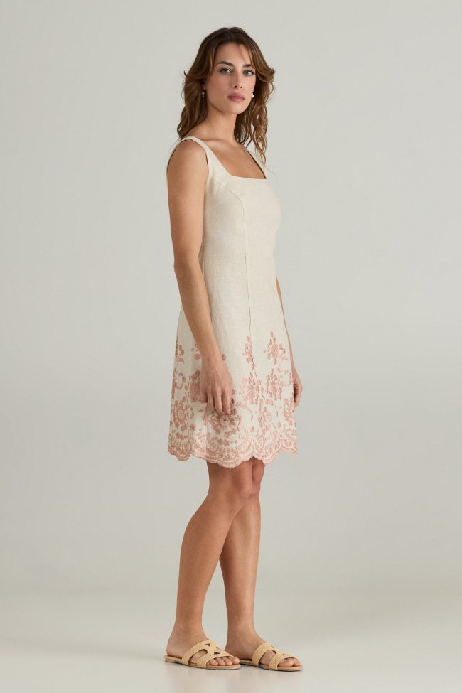 Celeste Embroidered Linen Dress – Sleeveless beige linen dress with intricate blush embroidery and a scalloped hem for a timeless feminine look.