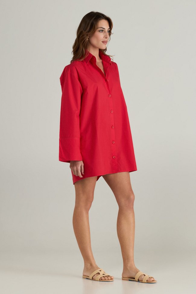 Model wearing a red travel dress,styled with minimal accessories and sandals