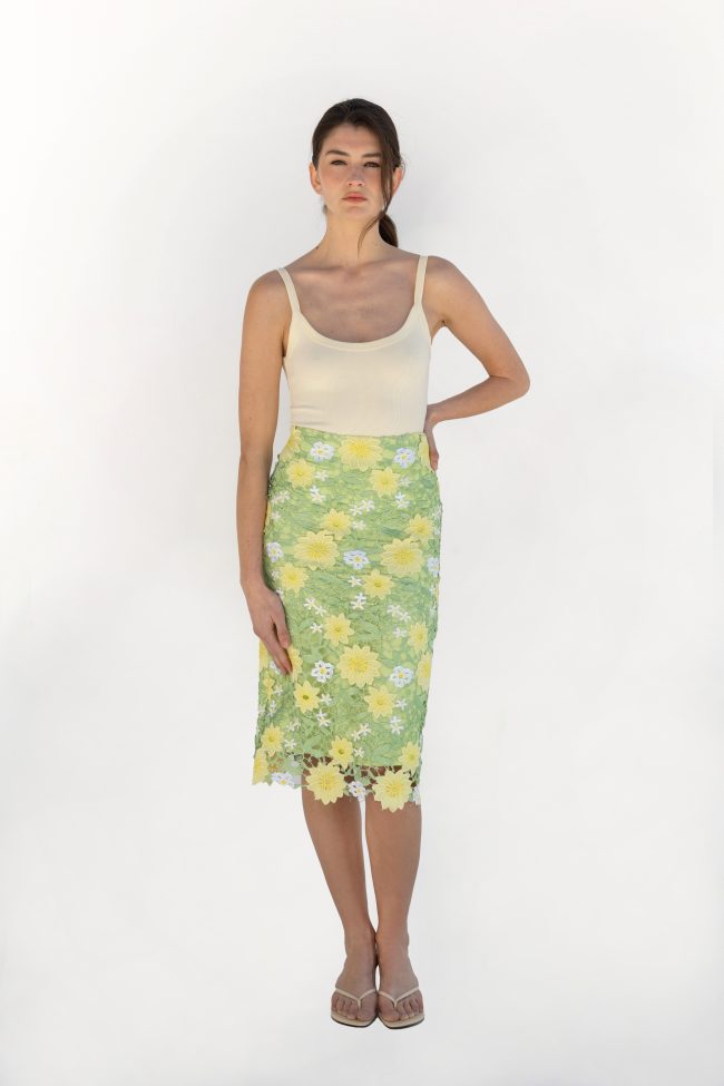 Model wearing Flicka Athens green floral lace midi skirt with yellow flowers front view