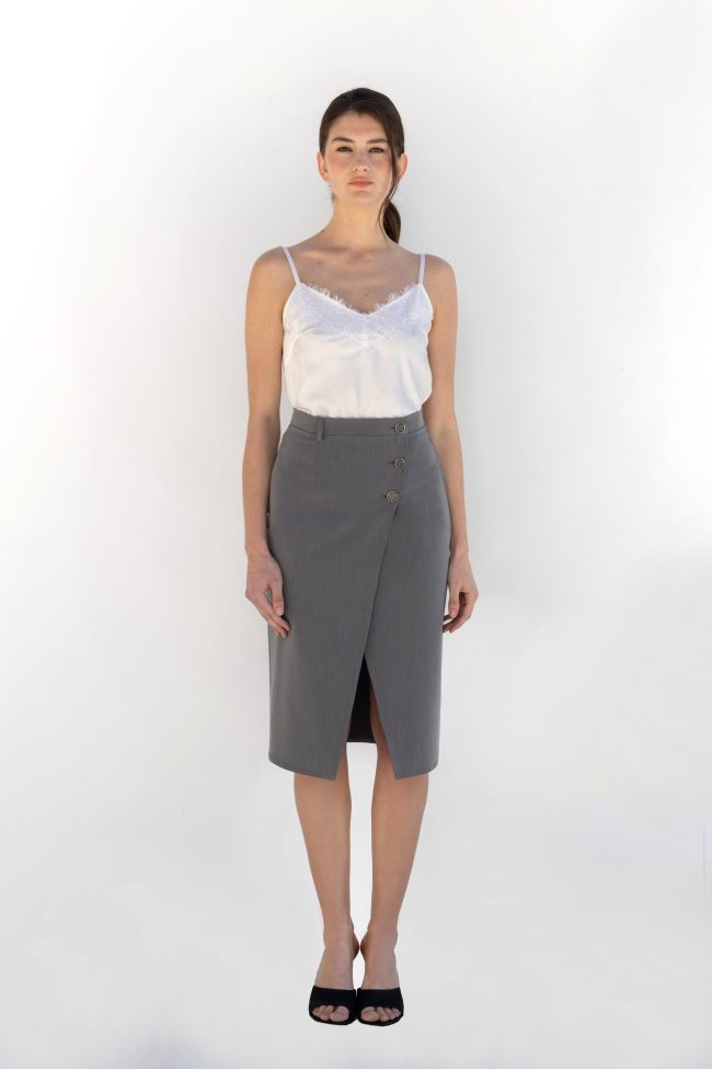 model wearing grey wrap midi skirt with buttons flicka athens front view Caption: Front view of grey wrap skirt